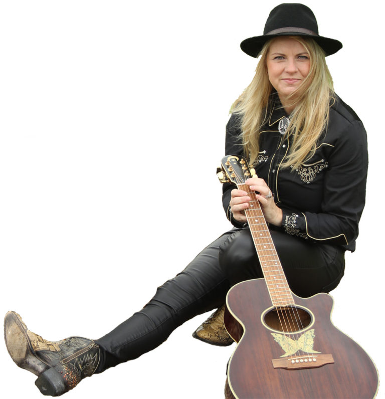 Patries Grijpstra sitting with a guitar in her hands